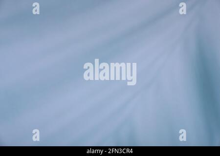 Palm leaf shadows on a blue background Stock Photo