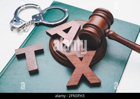 Word TAX with judge's gavel and book on white background Stock Photo