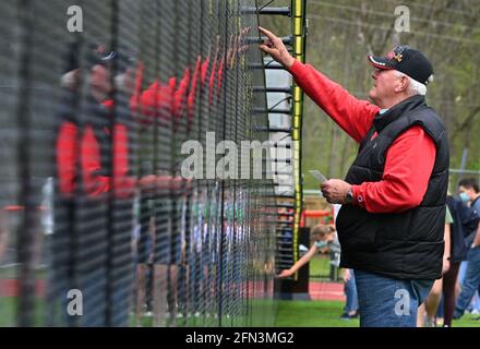 Tunkhannock, United States. 13th May, 2021. A man is reflected in The Wall That Heals a replica of the Vietnam Memorial wall, while looking for a name on the wall.The Wall That Heals is a three-quarter scale replica of the Vietnam Veterans Memorial in Washington, DC, the wall travels around the country and is set up and displayed for 24 hours a day while it is in place. Credit: SOPA Images Limited/Alamy Live News Stock Photo