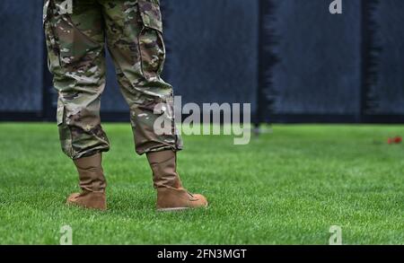 Tunkhannock, United States. 13th May, 2021. A man wearing military fatigues looks at the Wall that Heals a replica of the Vietnam Memorial.The Wall That Heals is a three-quarter scale replica of the Vietnam Veterans Memorial in Washington, DC, the wall travels around the country and is set up and displayed for 24 hours a day while it is in place. Credit: SOPA Images Limited/Alamy Live News Stock Photo