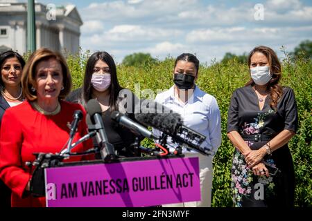 Mayra Guillen, third from left, Lupe Guillen, second from right, sisters of Vanessa Guillen, and United States Representative Veronica Escobar (Democrat of Texas), right, listen while Speaker of the United States House of Representatives Nancy Pelosi (Democrat of California) offers remarks during a press conference for the reintroduction of the I am Vanessa Guillén Act, outside the US Capitol in Washington, DC, Thursday, May 13, 2021. The killing of 20 year-old Army Specialist Vanessa Guillen at Fort Hood in Texas last year caused outrage, as Guillen's family said Vanessa was harassed prior to Stock Photo