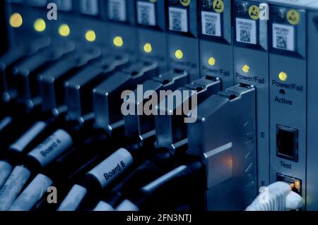 Network connection technology with broadband aggregation carrier electronic equipment, row of data cables and status LEDs to show working status of da Stock Photo