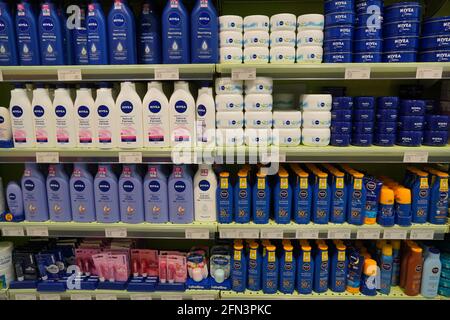 Nivea Serum, Fairness Lotion, Lip Gloss, Sun Block, Sunscreen, Sun Spray. Bottles And Jars. Nivea Skincare And Cosmetic Products For Sell On Supermark Stock Photo