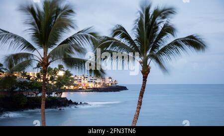 Keauhou Bay at night lit by the Sheraton Kona Resort and Spa, a popular site for night manta ray dives on the Big Island of Hawaii Stock Photo