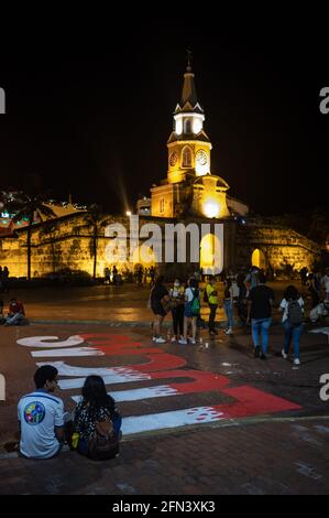 Group of artists painting a graffiti in memory of Lucas Villa, an icon of peaceful protest in Colombia who was shot eight times in Pereira. Stock Photo