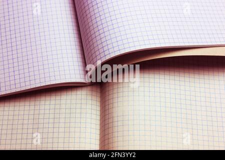 Blank notebook pages background flatly. Opened notepad notebook with a checkered sheets. Vintage looking blank sheet in a cage from the school noteboo Stock Photo