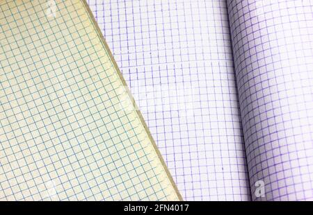 Blank notebook pages background flatly. Opened notepad notebook with a checkered sheets. Vintage looking blank sheet in a cage from the school noteboo Stock Photo