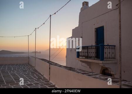 Plaka, Greece. 13th May, 2021. The sun rises behind a house. On 14.05.2021, the tourism season will officially begin in Greece - restaurateurs, hoteliers and shopkeepers await it with hope and trepidation in equal measure. Credit: Socrates Baltagiannis/dpa/Alamy Live News Stock Photo