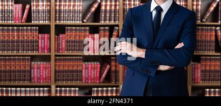 Male Attorney With Arms Crossed. Lawyer In Office Stock Photo