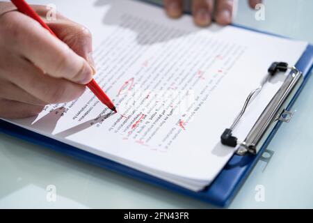 Editing Essay Content On Paper. Proofreader Marking Mistake Stock Photo