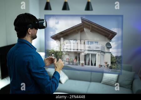 Virtual Real Estate House Tour Using VR Headset Stock Photo