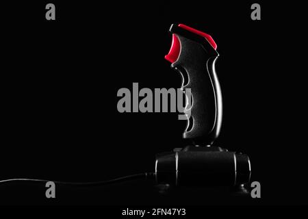 Gamepad Retro joystick from 8-bit consoles. Game controller isolated on black background Stock Photo