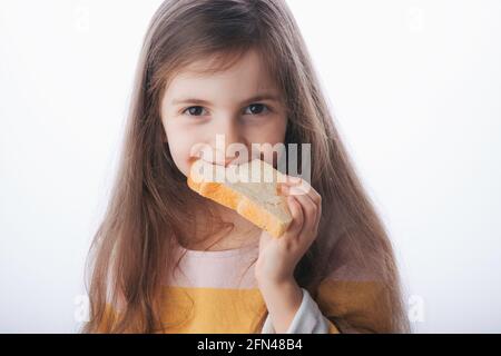Little girl hold slice of homemade healthy bread Stock Photo