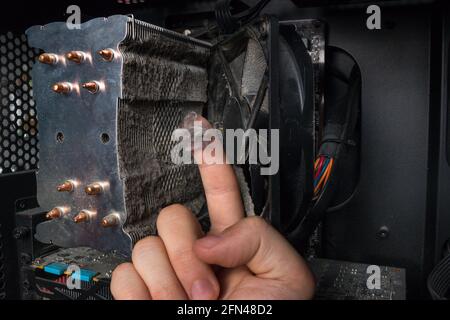 computer technician showed dust, dirt on the PC hardware Stock Photo