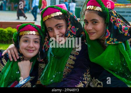 Turkish girls dressed in folk costume, waiting their turn to