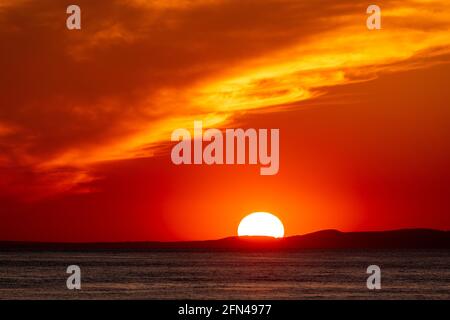 Sunset over the Llyn Peninsula from Barmouth, welsh coast Stock Photo