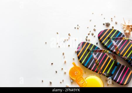 flip-flops and orange juice on a white background with space for text. summer holidays / vacation concept Stock Photo