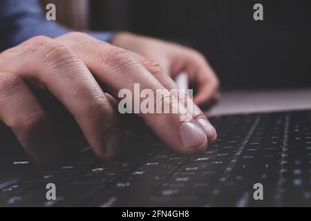 Close up photo of man hand using laptop. Concept business and financial investment. Personal finance wellness. Stock Photo