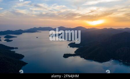 This is a mesmerizing view of nature from Mugla Akyaka. The combination of different shades in the sky while creates an amazing scenery, the sea by re Stock Photo