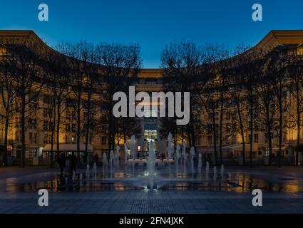Shot at night of the east side entrance of the shopping mall Polygone with the fountain, Antigone district in winter Stock Photo
