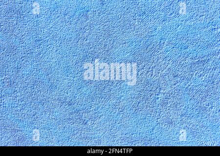 Textured blue stone wall background. Rough surface. Copy space Stock Photo