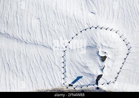 Aerial view of the Pla de Beret meadows in winter. Source of the river Noguera Pallaresa (Aran Valley, Catalonia, Spain, Pyrenees) Stock Photo