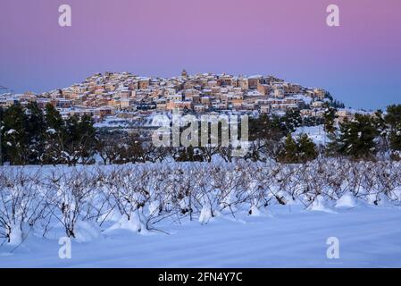 Horta de Sant Joan village, in a winter snowy twilight with venus belt after a heavy snowfall (Terra Alta, Tarragona, Catalonia, Spain) Stock Photo
