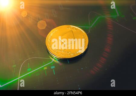 Ethereum cryptocurrency coin and background with green stock chart, big growth of crypto coin concept Stock Photo