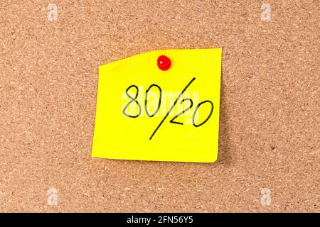 Pareto principle or 80 20 rule represented on a sticky note - a reminder or advice. Stock Photo