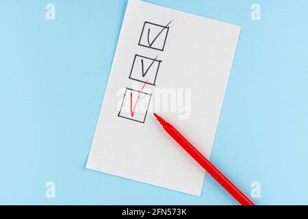 Red marking on checklist box with pen, Checklist concept. Stock Photo