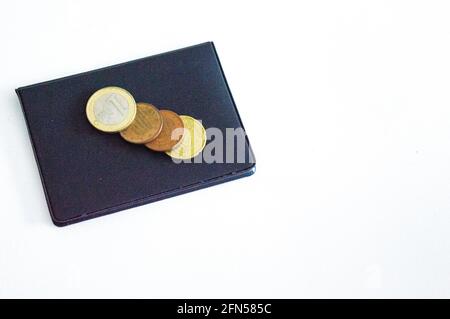 Wallet for business cards and credit cards with coins on top. Copy space Stock Photo