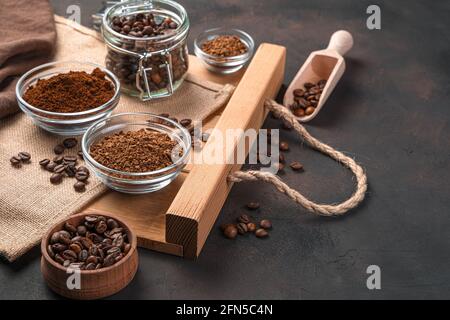 Grain, ground and instant coffee on a brown background with space to copy. Side view, horizontal. Stock Photo