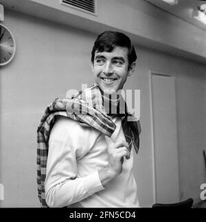 The comedy actor John Alderton smiles in a corridor of TV studios, probably while recording the comedy series Please Sir. Stock Photo