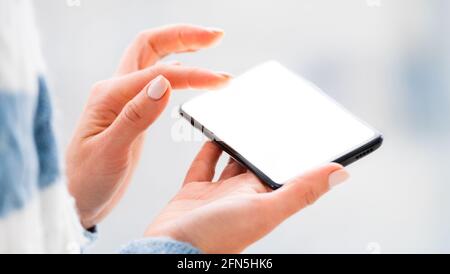 Hands working on mobile phone close up Stock Photo