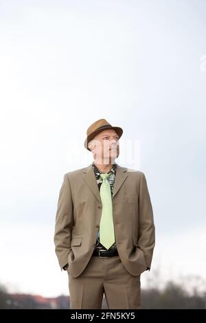 portrait of handsome man in his 50s in beige suit from the 1980s Stock Photo