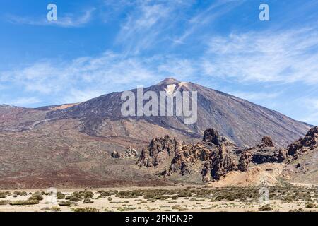 Mount Teide volcano seen across the Llano de Ucanca in spring, Las Canadas del Teide National Park, Tenerife, Canary Islands, Spain Stock Photo