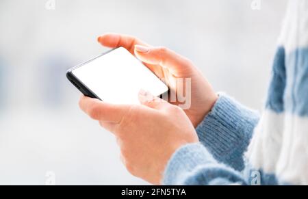 Hands working on mobile phone close up Stock Photo