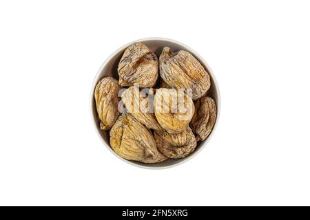 dried figs in a bowl on a white background. Stock Photo