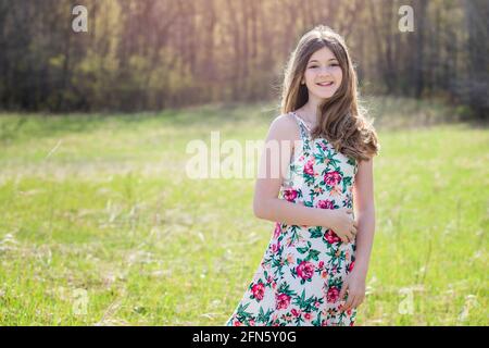 Beautiful Teen Girl Outdoors in Sundress, backlit. Stock Photo