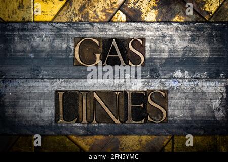 Gas Lines text on vintage textured grunge copper and gold steampunk background Stock Photo