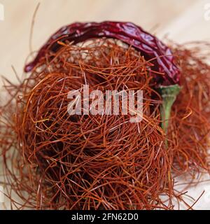 Chilli threads and chilli pod in a close-up Stock Photo