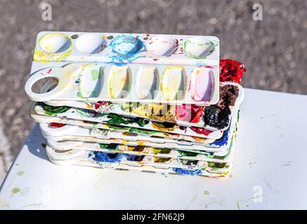 Plastic color mixing palettes. Drawing and creative tools close-up Stock Photo