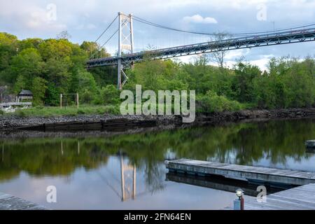 Kingston, NY - USA- May 12, 2021: a landscape view of the Wurts Street Bridge or the The Kingston–Port Ewen Suspension Bridge, is a steel suspension b Stock Photo