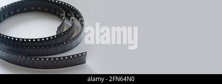 Electronic component on white background. Panoramic banner. SMD components in black plastic carrier tape with copyspace. Minimal electronic concept Stock Photo