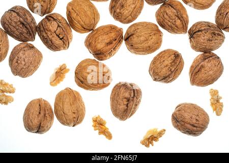 Nuts (whole and open) falling. Isolated on white background. Stock Photo
