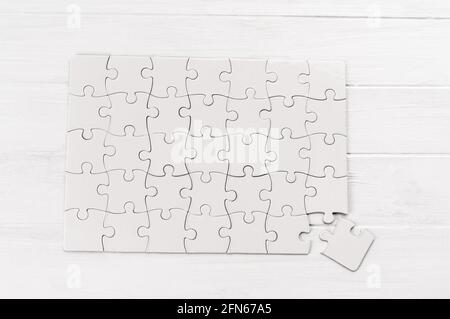 Rectangular jigsaw puzzle on white table Stock Photo