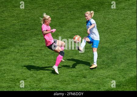 KHARKIV, UKRAINE - MAY 14, 2021:  Woman football match Zhilstroi-2 vs. Voshod. Public events are allowed. Europe match of football during CV pandemic. Stock Photo
