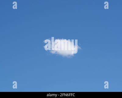 single lonely cloud in the blue sky Stock Photo