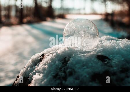 frozen soap bubble in winter Stock Photo