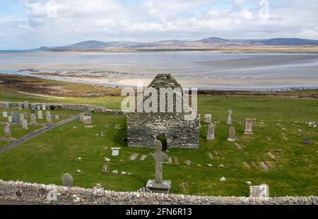 Aerial view Kilnave Chapel and Cross situated on the west bank of Loch Gruinart, Isle of Islay, Inner Hebrides, Scotland. Stock Photo